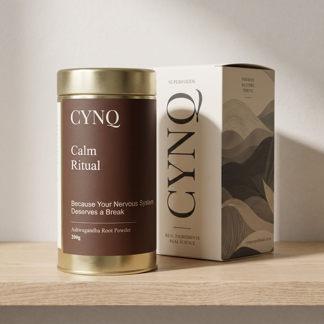 Calm Ritual ashwagandha powder tin beside the CYNQ outer box on an oak shelf